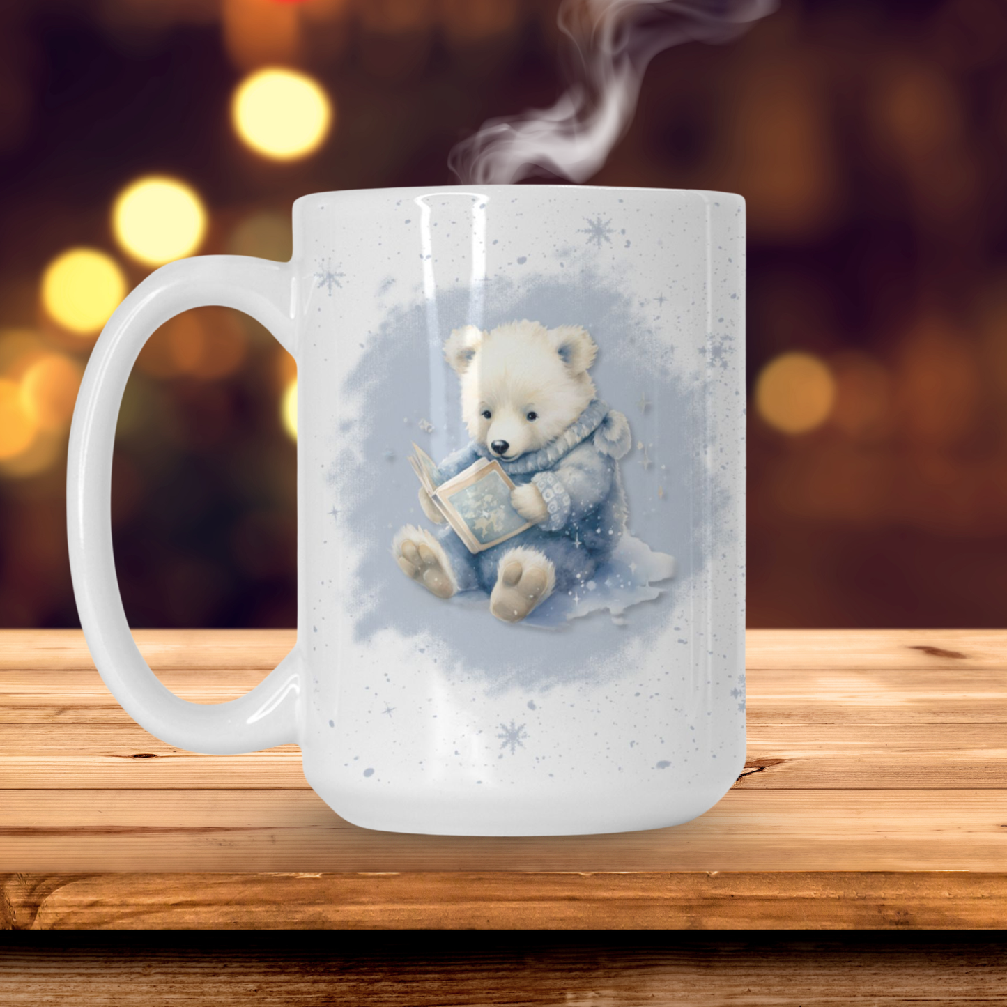 A white mug with a cuddly polar bear cub reading a book on the front. 