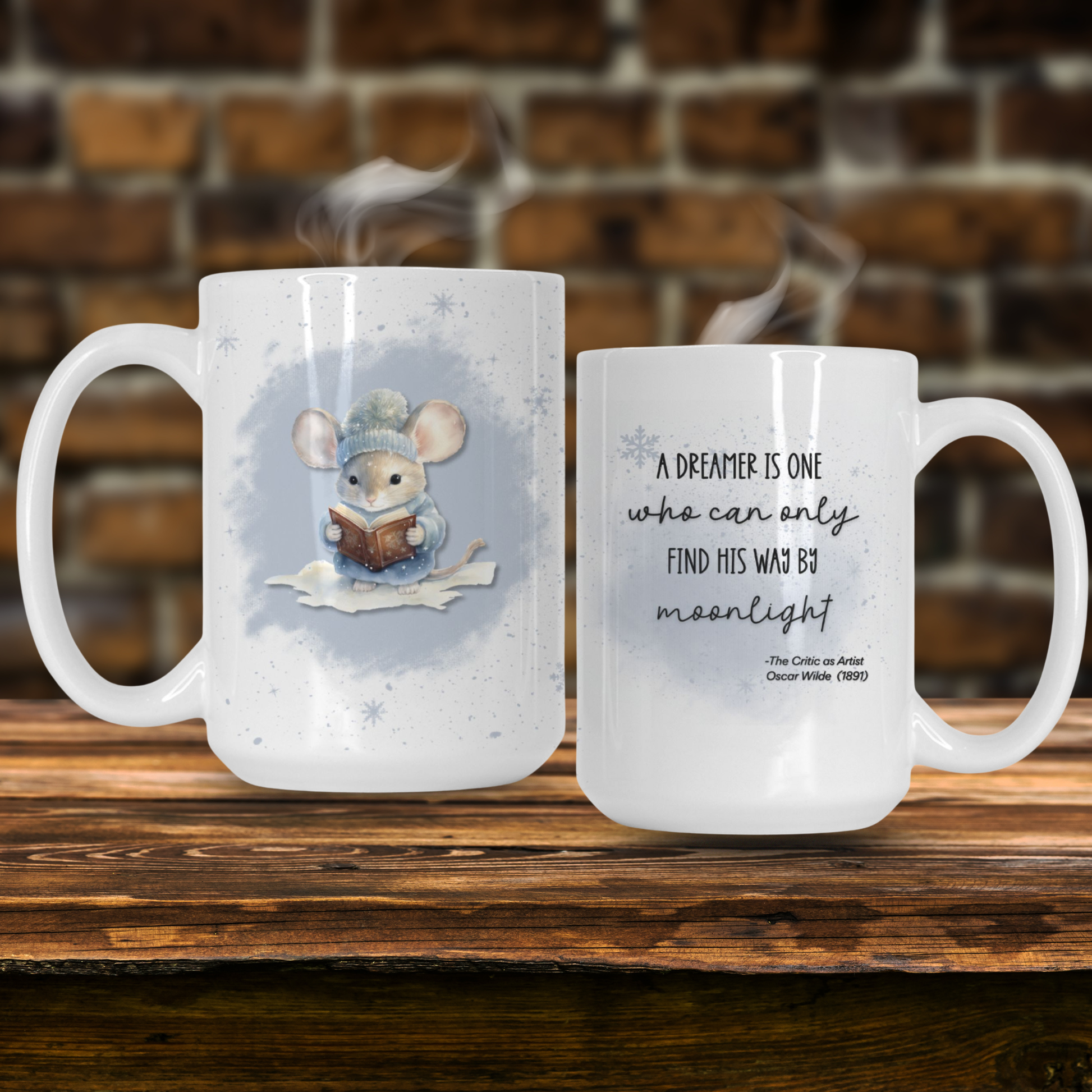 Two mugs on a wooden surface with one featuring a mouse illustration and the other with a quote.