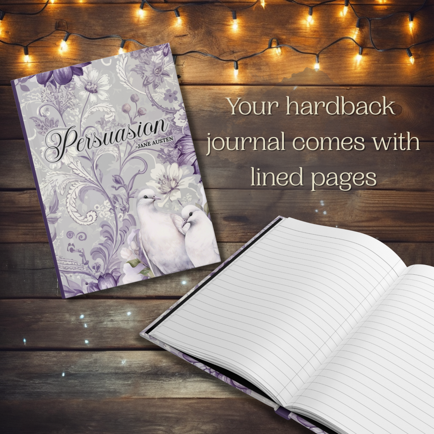 Hardback journal with floral design and lined pages on a wooden surface with string lights. Text reads, "Your hardback journal comes with lined pages."