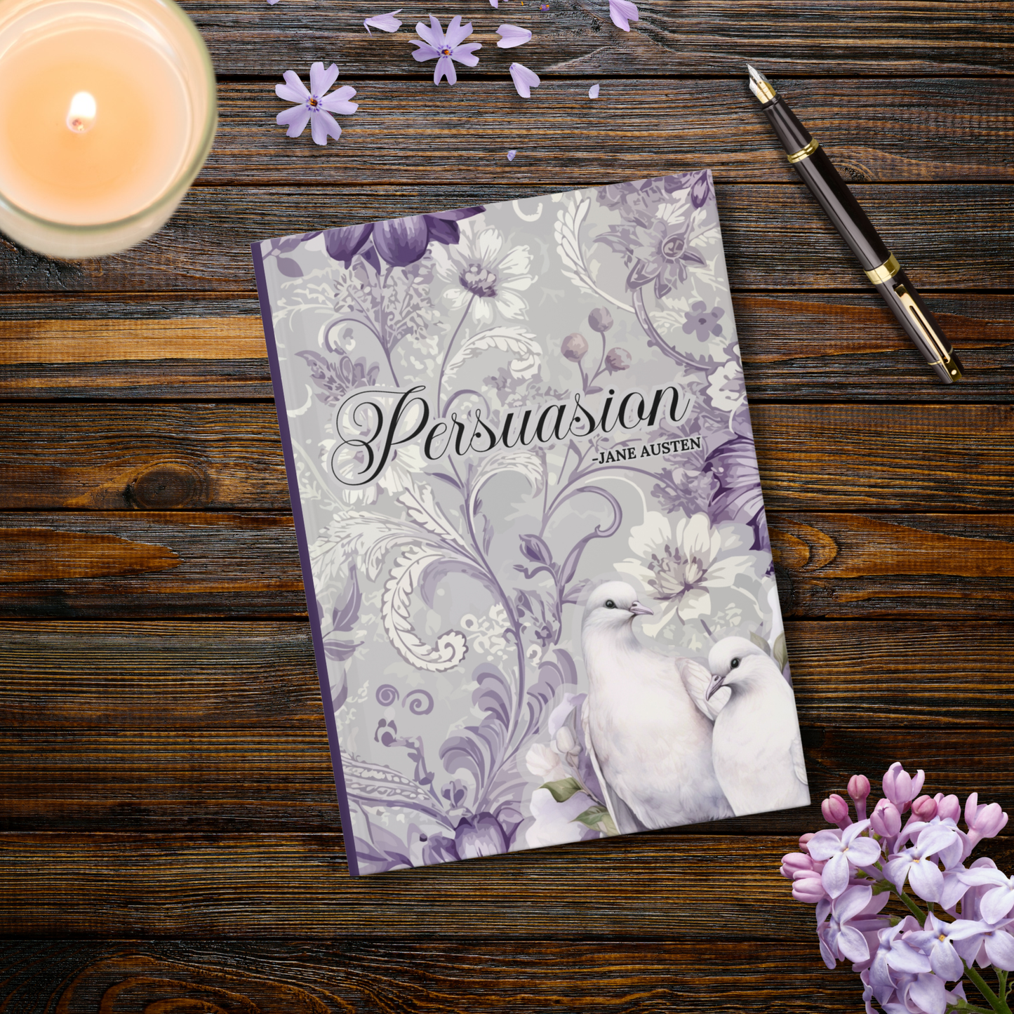Journal with the title 'Persuasion' by Jane Austen on a wooden surface with lavender flowers and a candle.