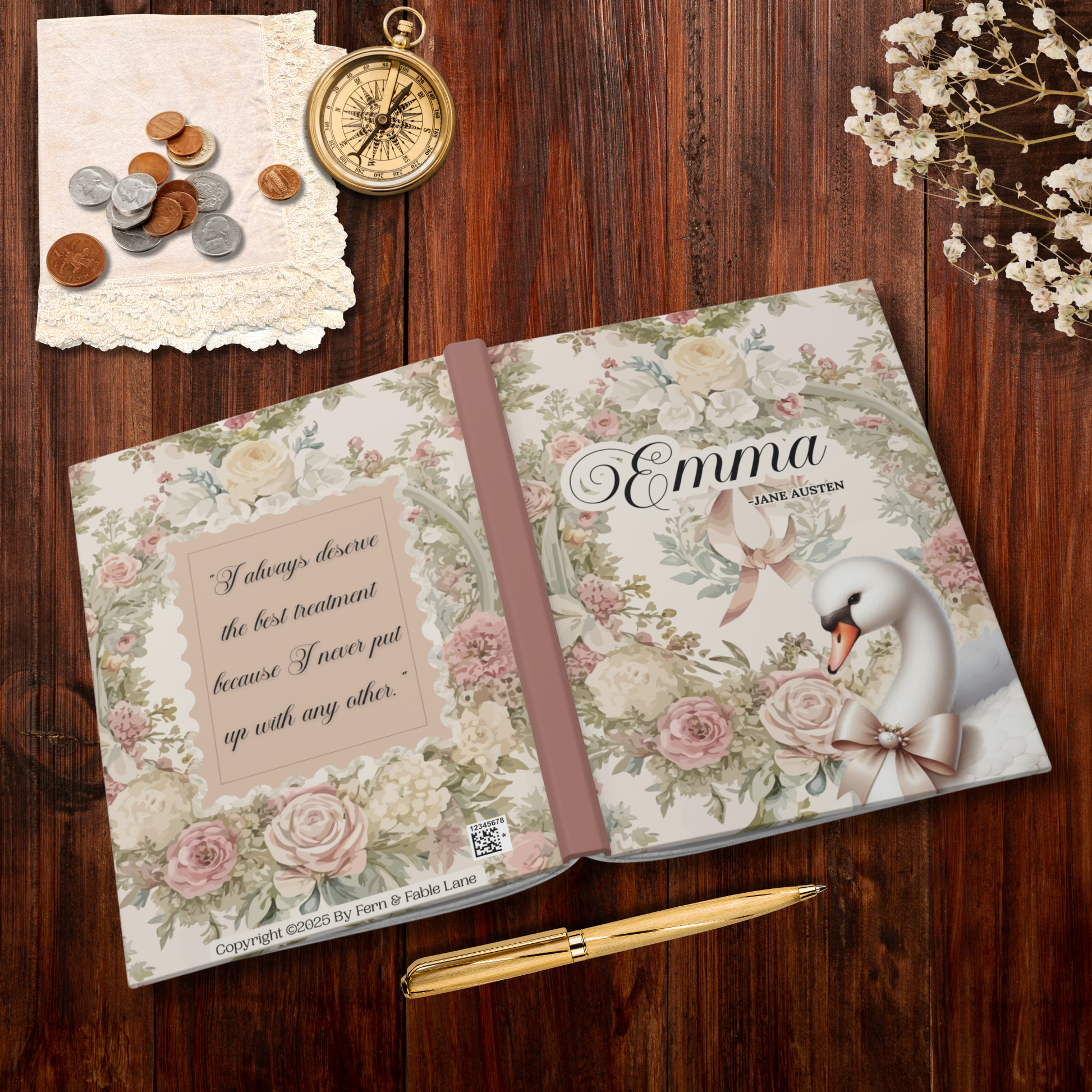 Floral toile notebook with 'Emma' by Jane Austen on a wooden surface with coins, a compass, and flowers.