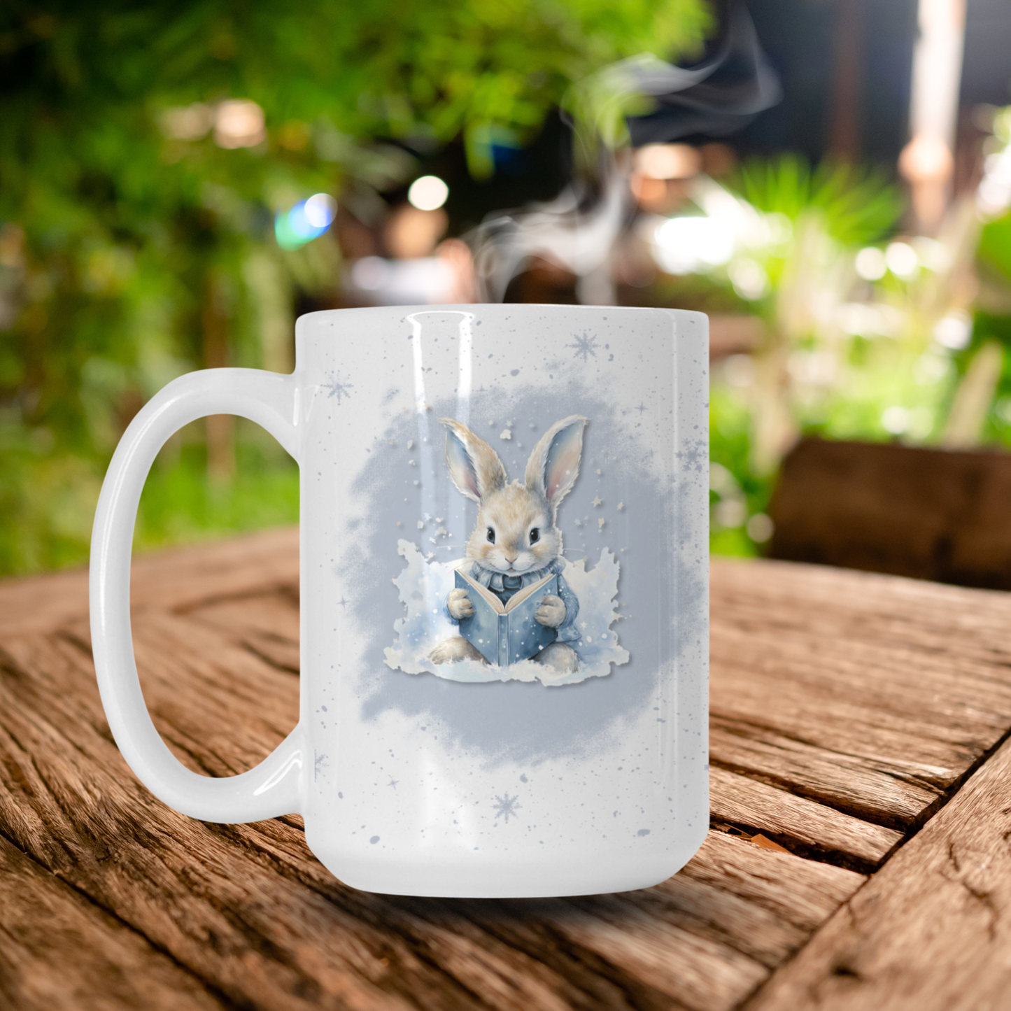 White mug with a rabbit design on a wooden table outdoors