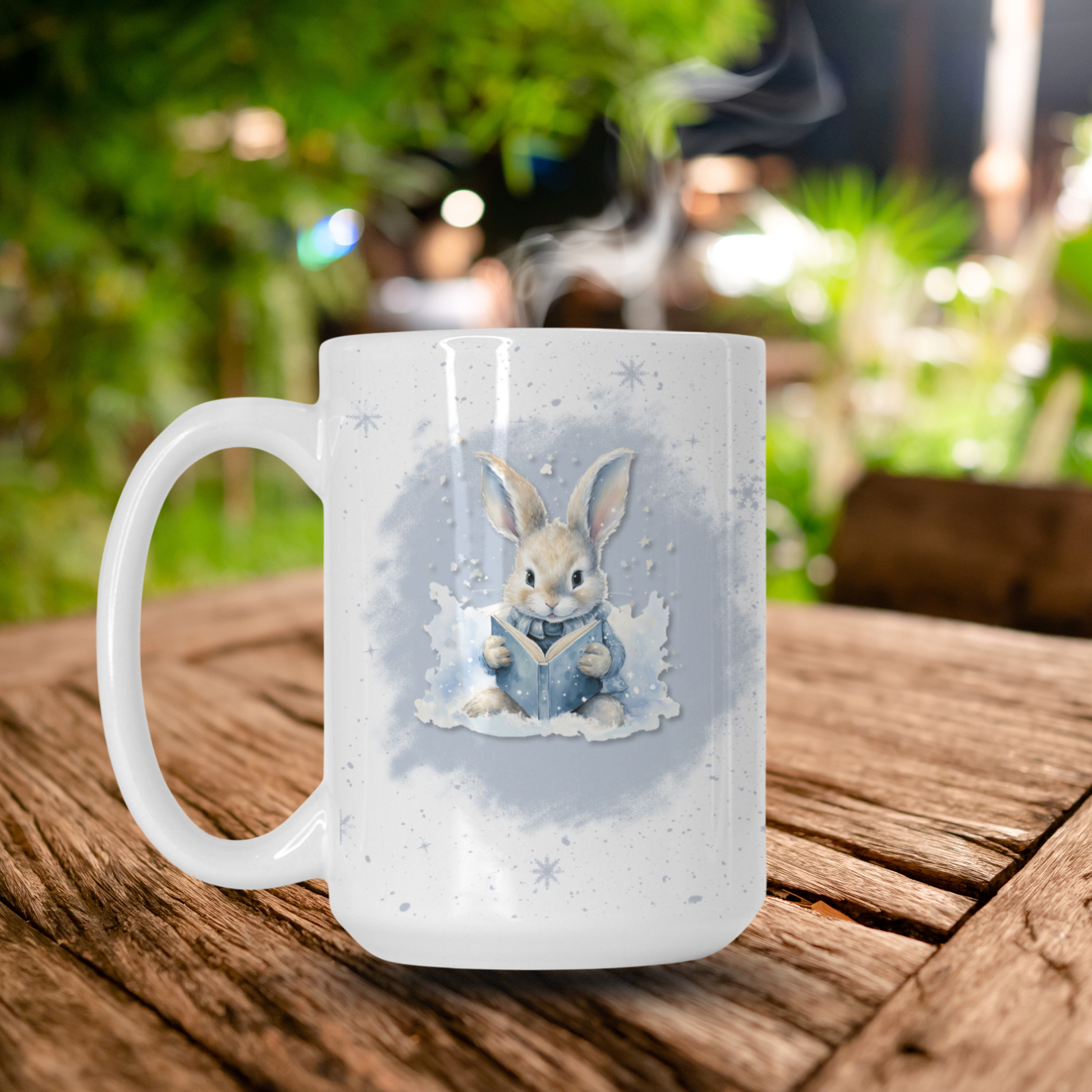 White mug with a rabbit design on a wooden table outdoors